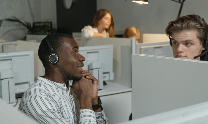 Call center team collaborating with headsets, providing efficient customer support.